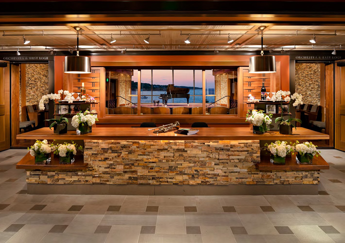 Norstone Split Face Stacked Stone Rock Panels used on the entrance lobby reception desk of a concert hall